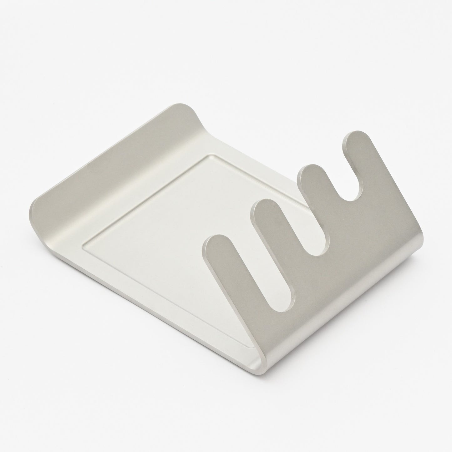 Alto stainless-steel utensil rest, three-quarter view showing slots and drip tray